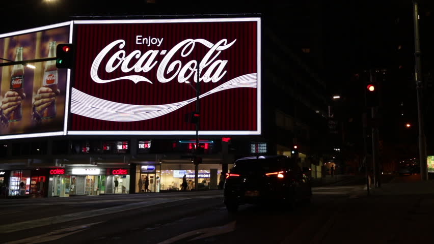 The Flashing Neon Sign Of The Coca-Cola Billboard In Kings Cross ...