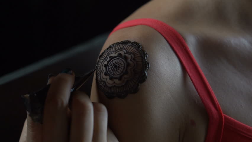 closeup video of henna tattoo artist draws on woman u0027s shoulder closeup video of henna tattoo artist draws on woman u0027s shoulder