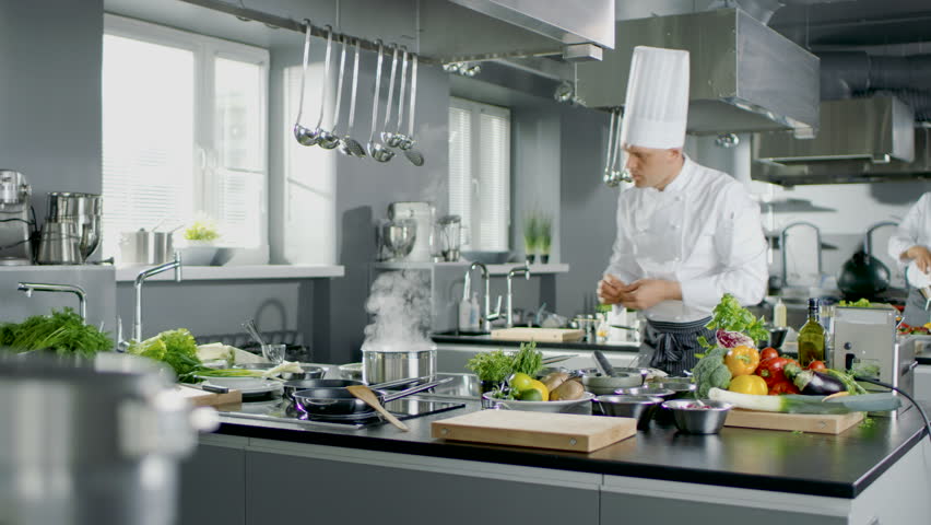Restaurant Kitchen Chefs time lapse of a busy team of chefs preparing food in a commercial Restaurant Kitchen Chefs time lapse of a busy team of chefs preparing food in a commercial