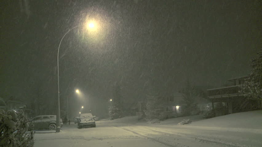 Stock video of night time snowfall in the neighborhood | 3085834 ...