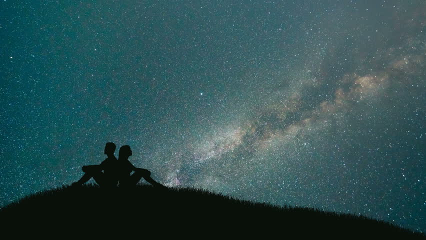 The Man And Woman Kissing On A Background Of Starry Sky. Time Lapse ...