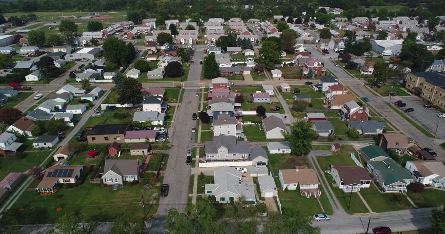 A Slowly Moving Dolly Forward Aerial Establishing Shot Of A Typical ...