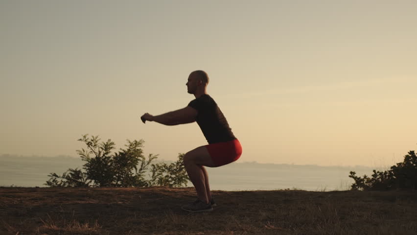 Side View Man With Short Hair Wearing Sport Clothes Doing Sit Ups