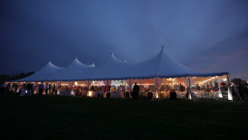 Hd00 15a Wide Shot Of A Tent Hosting A Wedding Reception At Night