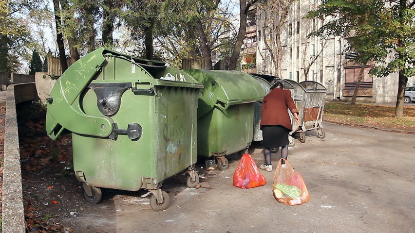 Homeless Woman Is Searching For Food In Garbage Dumpster/Woman In ...