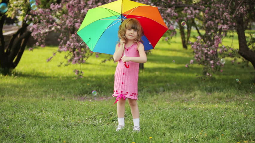 Kid Turnning The Umbrella And Stock Footage Video 100 Royalty Kid Turnning The Umbrella And Smiling