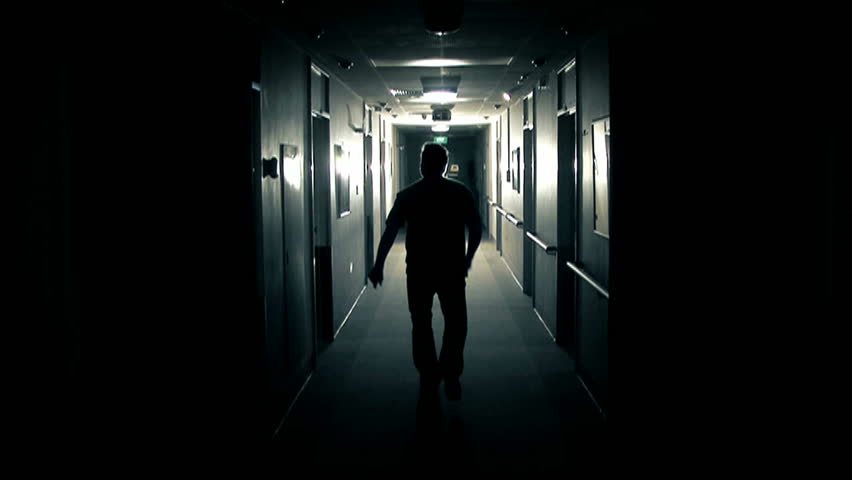 Man Walks Down Dark Hospital Stock Footage Video (100% Royalty-free 