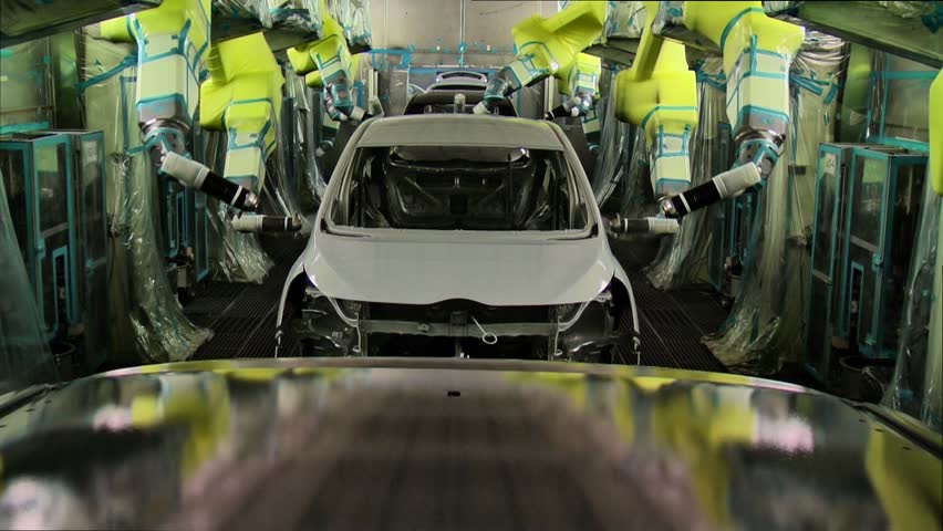 Robots are painting in automobile factory