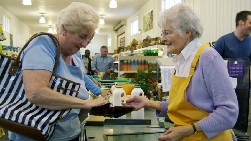 Image result for paying at the till in a supermarket