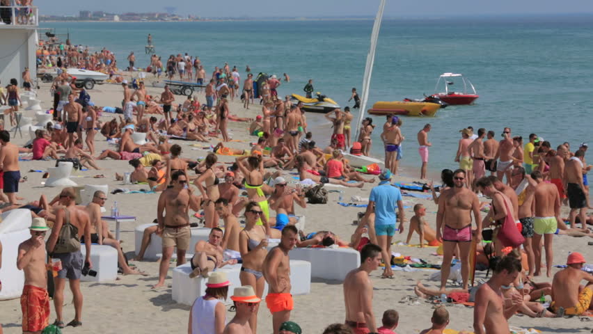 Tourists Having A Good Time On Miami Beach Stock Footage Video Crimea Ukraine 06 August 2017 Kazantip Festival Z People Relaxing On The