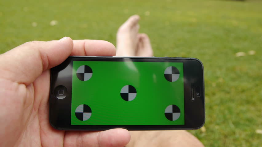 Using A Smart Phone Held Stock Footage 100 Royalty Free Using A Smart Phone Held By Hands While Sitting At The Park Green Screen Chroma Key Close Up Tracking Motion Horizontal Tile Floor Grass
