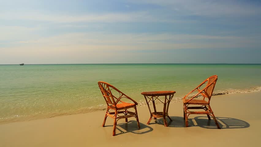 Wild Beach Two Empty Wooden Chairs Stock Footage Video 100 Royalty Wild Beach Two Empty Wooden Chairs And Table Standing In A Water