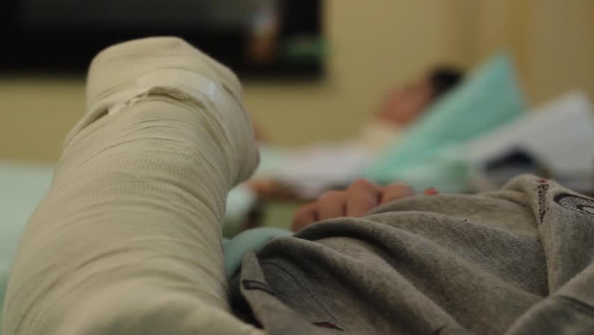 Patient With Broken Arm Lying In Hospital Bed Plaster In 