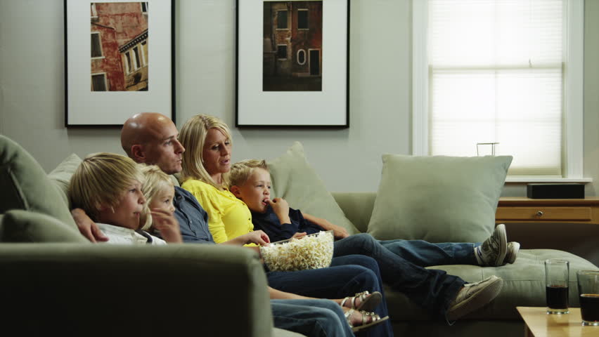 Living Room With Tv And People medium shot woman and man watching tv in living room stock footage Living Room With Tv And People medium shot woman and man watching tv in living room stock footage