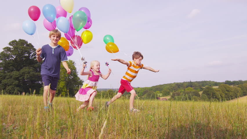 Children with Balloons Running Slow Stock Footage Video