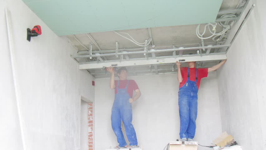 Hd00 17two Workers Assemble Ceiling Mount For Suspended Ceiling