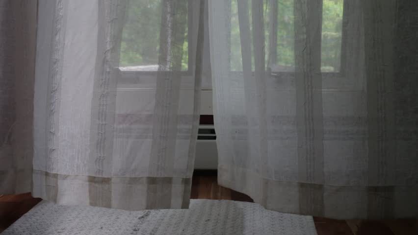 Curtains Slowly Blowing Back From The Wind