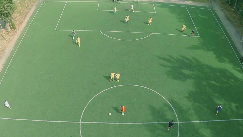 Children Are Playing Football. School Stadium. Playground. Aerial View