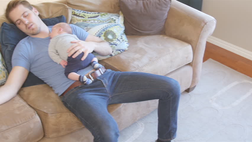 4k00 11father And Newborn Son Asleep On Couch