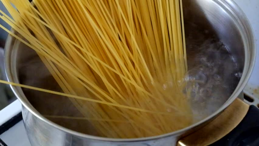 Putting Spaghetti Into A Pot Of Boiling Water Stock Footage Video ...